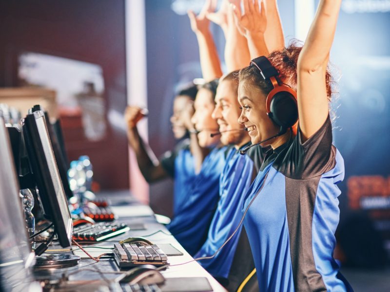 oung-multiracial-team-of-happy-professional-cyber-sport-gamers-celebrating.jpg